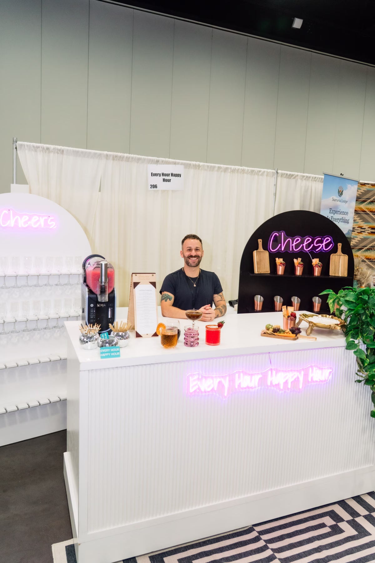 Wedding vendor displaying cheese and beverage service at Portland Wedding Show 2026 bridal expo booth